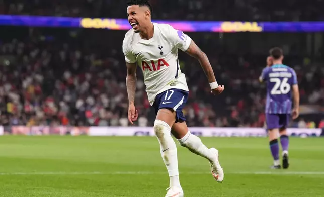 Tottenham Hotspur's Savio celebrates after his shot hit teammate Ben Davies, who scored their fifth goal during the Britain League Cup second round match against Charlton Athletic in London, Wednesday, Aug. 26, 2026. (John Walton/PA via AP)