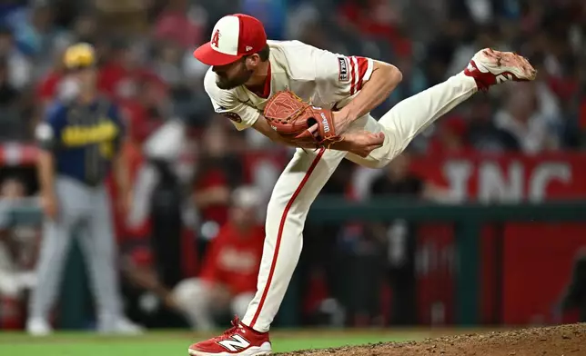 Los Angeles Angels pitcher Luke Murphy delivers in his major league debut during the eighth inning of a baseball game against the Milwaukee Brewers, Friday, July 31, 2026, in Anaheim, Calif. (AP Photo/William Liang)