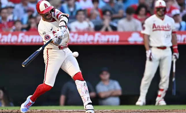 Los Angeles Angels' Zach Neto hits a single during the fourth inning of a baseball game against the Milwaukee Brewers, Friday, July 31, 2026, in Anaheim, Calif. (AP Photo/William Liang)