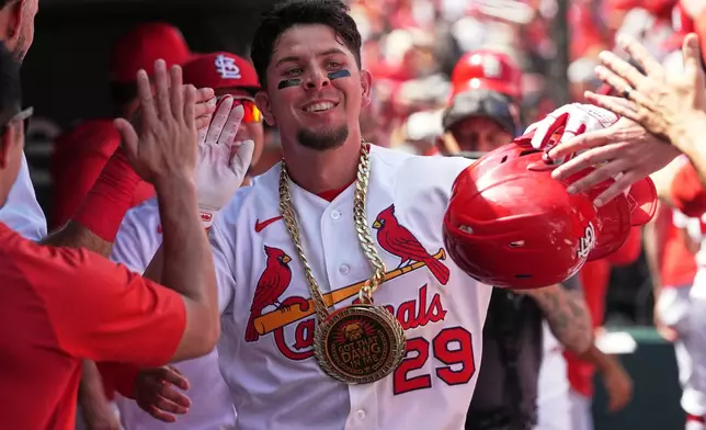 St. Louis Cardinals' Ramón Urías is congratulated by teammates after hitting a two-run home run during the fourth inning of a baseball game against the Baltimore Orioles Thursday, Aug. 27, 2026, in St. Louis. (AP Photo/Jeff Roberson)