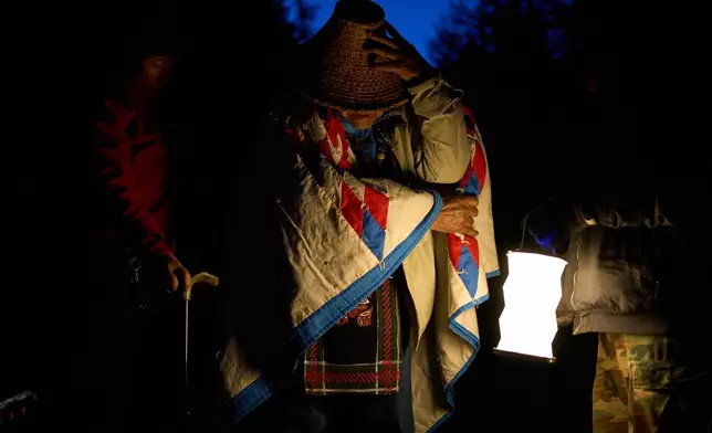 Bill Jones, a First Nations Pacheedaht elder, prepares to join a blockade on a road used for logging before dawn near Port Renfrew, British Columbia, Thursday, May 28, 2026. (AP Photo/Annika Hammerschlag)