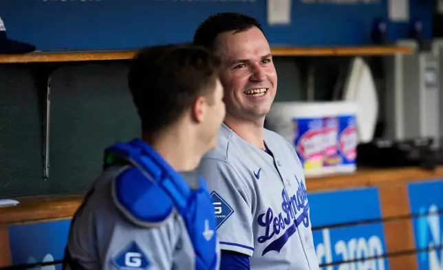 Los Angeles Dodgers pitcher Tarik Skubal smiles in the dugout against the Detroit Tigers during the first inning of a baseball game Friday, Aug. 28, 2026, in Detroit. (AP Photo/Paul Sancya)