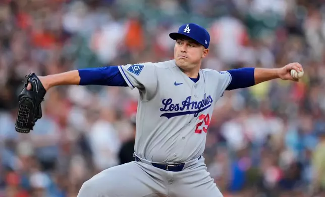 Los Angeles Dodgers pitcher Tarik Skubal throws against the Detroit Tigers during the first inning of a baseball game Friday, Aug. 28, 2026, in Detroit. (AP Photo/Paul Sancya)