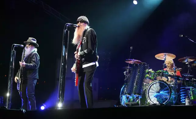FILE - Billy Gibbons, from left, Dusty Hill and Frank Beard of ZZ Top, perform in Monaco on July 5, 2010. (AP Photo/Lionel Cironneau, File)