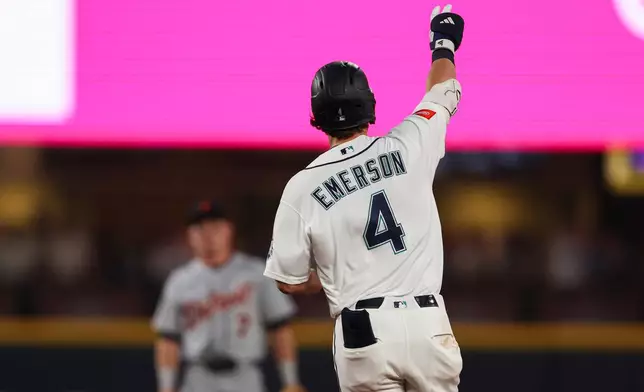 Seattle Mariners' Colt Emerson (4) reacts after hitting a solo home run in the eighth inning of a baseball game against the Detroit Tigers, Wednesday, Aug. 5, 2026, in Seattle. (AP Photo/Kevin Ng)