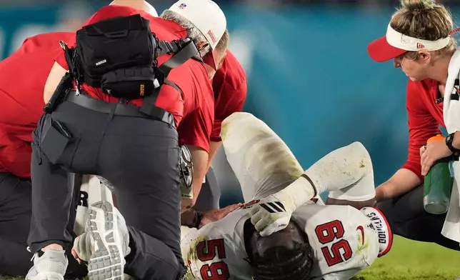 Tampa Bay Buccaneers linebacker Mohamed Kamara (59) lies on the field during the second half of an NFL preseason football game against the Jacksonville Jaguars, Friday, Aug. 28, 2026, in Jacksonville, Fla. (AP Photo/Mike Stewart)