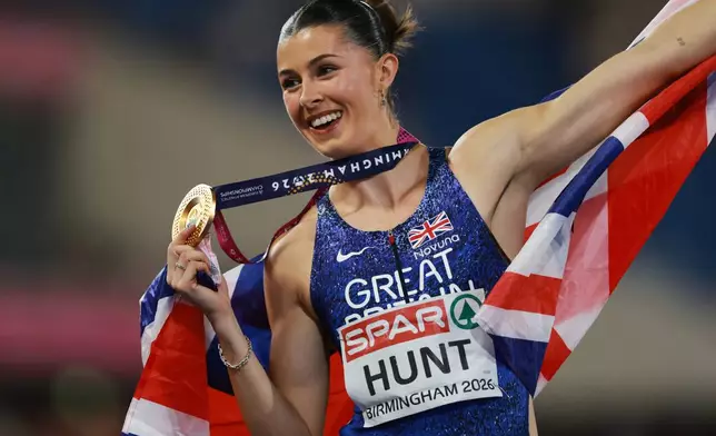 Amy Hunt of Britain poses with her gold medal after winning the women's 200 meters final at the European Athletics Championships in Birmingham, England, Thursday, Aug. 13, 2026. (AP Photo/Morgan Harlow)
