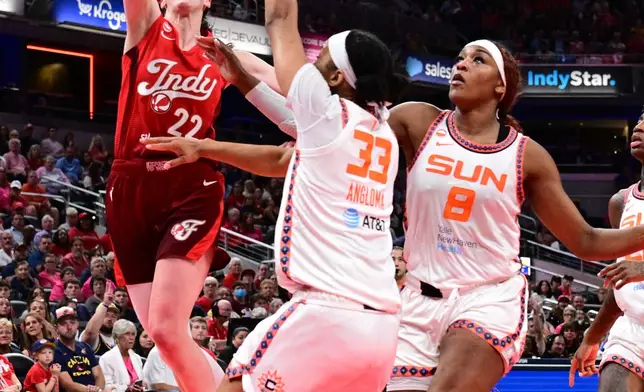 Indiana Fever guard Caitlin Clark (22) shoots the ball over Connecticut Sun forward Nell Angloma (33) during the first half of an WNBA basketball game, Friday, Aug. 28, 2026, in Indianapolis. (AP Photo/Marc Lebryk)