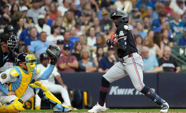 Minnesota Twins' Kaelen Culpepper gets hit by a pitch during the sixth inning of a baseball game against the Milwaukee Brewers, Saturday, Aug. 8, 2026, in Milwaukee. (AP Photo/Aaron Gash)