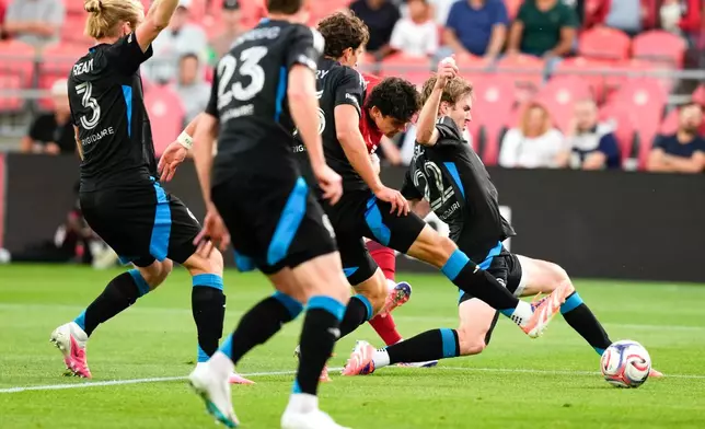 Toronto FC's Markus Cimermancic (second right) tries to get a shot a goal through the Charlotte FC defence during the first half of a MLS soccer game in Toronto, Wednesday, Aug. 19, 2026. (Chris Young/The Canadian Press via AP)