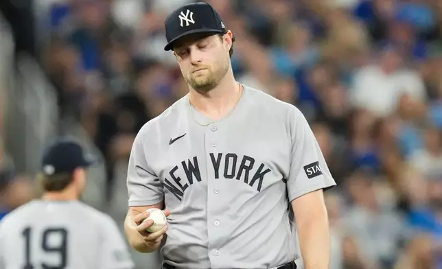 New York Yankees pitcher Gerrit Cole (45) reacts during the sixth inning of a baseball game in Toronto, Friday, Aug. 14, 2026. (Chris Young/The Canadian Press via AP)