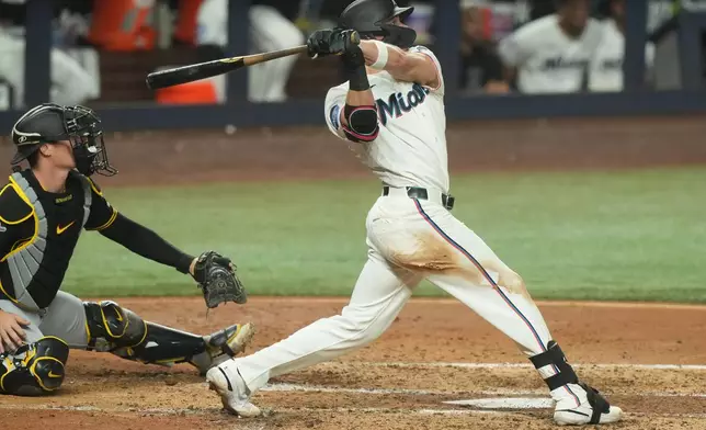 Miami Marlins' Griffin Conine hits a home run during the fourth inning of a baseball game against the Pittsburgh Pirates Wednesday, Aug. 12, 2026, in Miami. (AP Photo/Marta Lavandier)