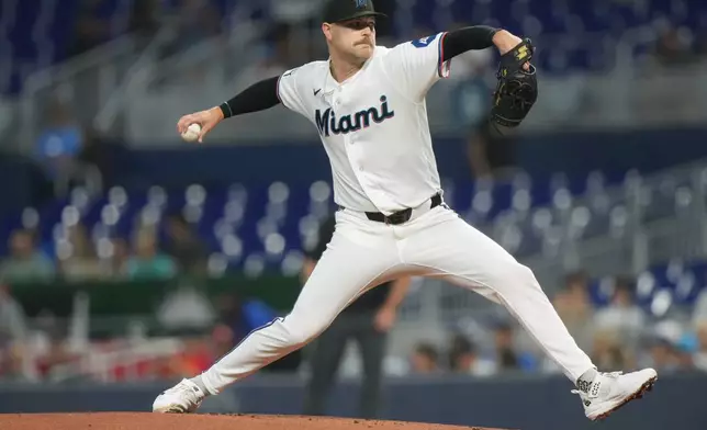 Miami Marlins starting pitcher Janson Junk aims a pitch during the first inning of a baseball game against the Pittsburgh Pirates Wednesday, Aug. 12, 2026, in Miami. (AP Photo/Marta Lavandier)