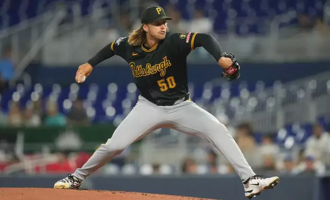Pittsburgh Pirates starting pitcher Carmen Mlodzinski (50) aims a pitch during the first inning of a baseball game against the Miami Marlins Wednesday, Aug. 12, 2026, in Miami. (AP Photo/Marta Lavandier)