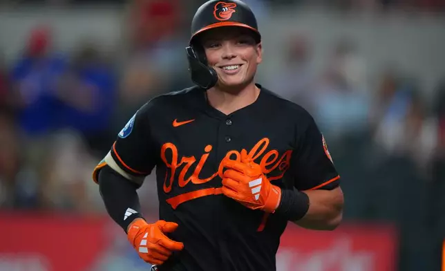 Baltimore Orioles' Jackson Holliday smiles after hitting a home run during the first inning of a baseball game against the Texas Rangers, Saturday, Aug. 8, 2026, in Arlington, Texas. (AP Photo/LM Otero)