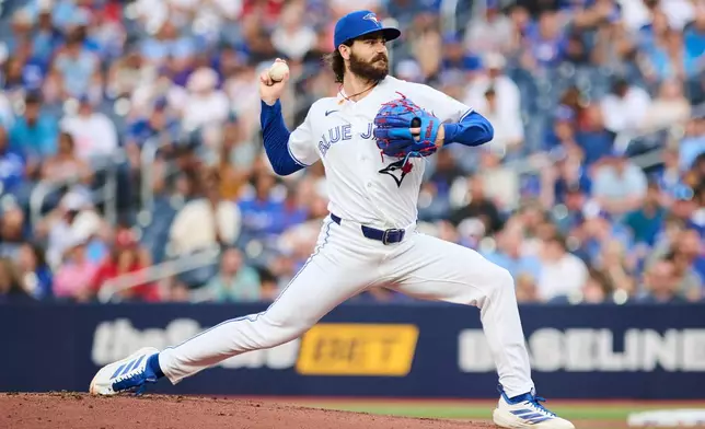 Toronto Blue Jays' Dylan Cease (84) pitches against the Boston Red Sox during the first inning of a baseball game in Toronto, Tuesday, Aug. 11, 2026. (Sammy Kogan/The Canadian Press via AP)