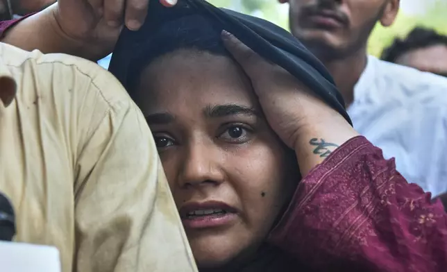 A woman, who lost her baby in a hospital fire, reacts at a hospital in Islamabad, Pakistan, Wednesday, Aug. 26, 2026. (AP Photo)