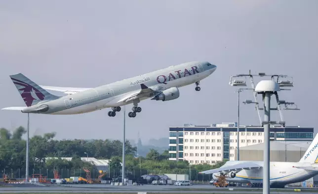 FILE -A Qatar Airways plane takes off from Leipzig/Halle Airport, July 18, 2025, Saxony, Schkeuditz. (Jan Woitas/dpa/dpa via AP, File)