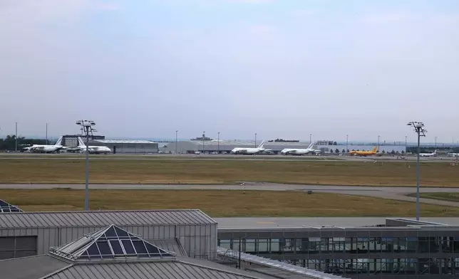A view of Leipzig/Halle Airport where flight operations were suspended overnight after a sighting of a flying was reported and another object was found near a runway, in Schkeuditz, Germany, Wednesday, Aug. 5, 2026. (Tobias Junghanns/dpa via AP)