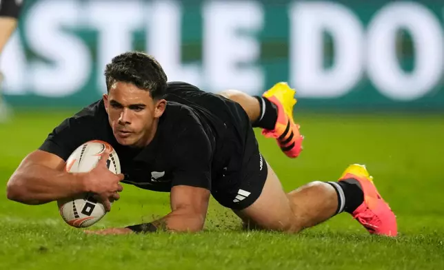 New Zealand's Noah Hotham scores a try during an international friendly rugby match between Lions and New Zealand, in Johannesburg, South Africa, Tuesday, Aug. 25, 2026. (AP Photo/Themba Hadebe)