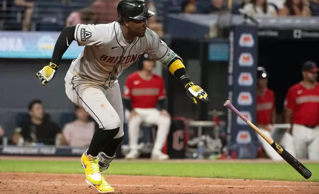 Arizona Diamondbacks' Geraldo Perdomo watches his two-run single off Cleveland Guardians relief pitcher Tim Herrin during the ninth inning of a baseball game, Saturday, Aug. 1, 2026, in Cleveland. (AP Photo/Phil Long)