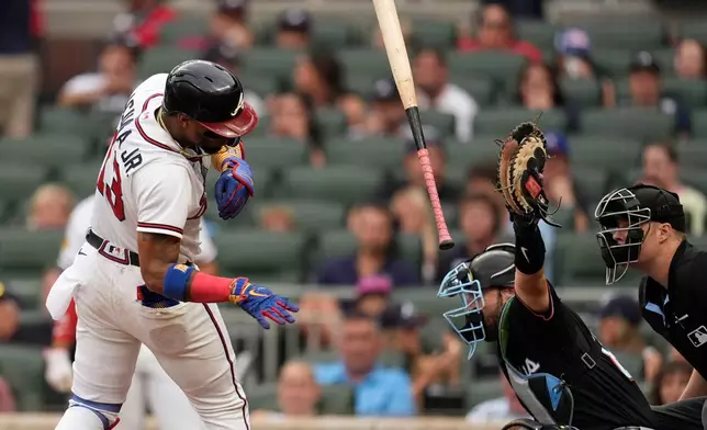Atlanta Braves' Ronald Acuña Jr. (13) ducks a pitch by Miami Marlins pitcher Eury Pérez (39) in the second inning of a baseball game, Wednesday, Aug. 5, 2026, in Atlanta. (AP Photo/Mike Stewart)