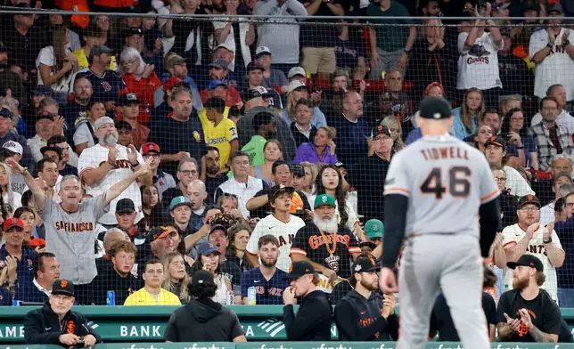 San Francisco Giants fans cheer as starting pitcher Blade Tidwell (46) leaves during the sixth inning of a baseball game against the Boston Red Sox, Saturday, Aug. 22, 2026, in Boston. (AP Photo/Mary Schwalm)