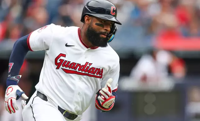 Cleveland Guardians' Jo Adell runs after hitting a two-run double against the Kansas City Royals in the third inning of a baseball game in Cleveland, Sunday, Aug. 30, 2026. (AP Photo/Tim Phillis)
