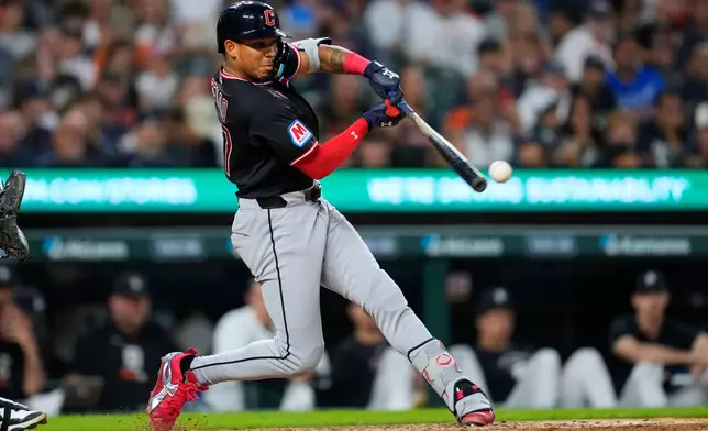 Cleveland Guardians' Angel Genao hits a one-run double against the Detroit Tigers during the seventh inning of a baseball game Wednesday, Aug. 12, 2026, in Detroit. (AP Photo/Paul Sancya)