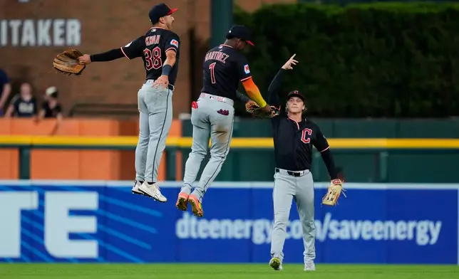 Cleveland Guardians outfielders Steven Kwan, from left, Angel MartÌnez and Petey Halpin celebrate after the final out against the Detroit Tigers during the ninth inning of a baseball game Wednesday, Aug. 12, 2026, in Detroit. (AP Photo/Paul Sancya)