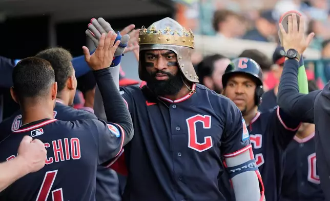 Cleveland Guardians' Jo Adell celebrates his two-run home run against the Detroit Tigers during the fifth inning of a baseball game Wednesday, Aug. 12, 2026, in Detroit. (AP Photo/Paul Sancya)