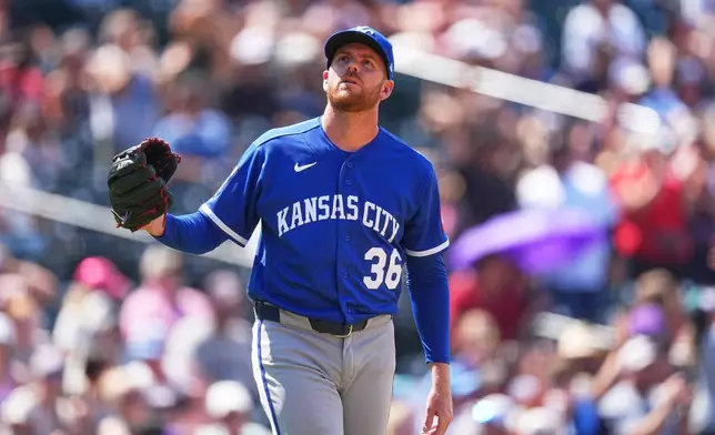 Kansas City Royals relief pitcher Aaron Bummer reacts after giving up a three-run home run to Colorado Rockies' Jake McCarthy in the sixth inning of a baseball game Sunday, Aug. 2, 2026, in Denver. (AP Photo/David Zalubowski)