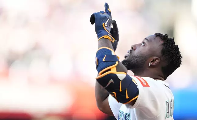 Seattle Mariners' Randy Arozarena reacts after hitting a single against the Chicago Cubs during the fifth inning of a baseball game, Saturday, Aug. 22, 2026, in Seattle. (AP Photo/Lindsey Wasson)