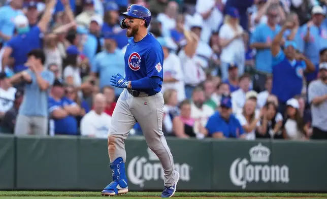 Chicago Cubs' Michael Busch reacts while jogging the bases after hitting a solo home run against the Seattle Mariners during the sixth inning of a baseball game, Saturday, Aug. 22, 2026, in Seattle. (AP Photo/Lindsey Wasson)