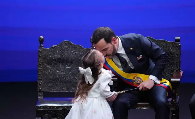 Francesca kisses her father, Colombia's President Abelardo de la Espriella, after he took the oath of office in Cali, Colombia, Friday, Aug. 7, 2026. (AP Photo/Matias Delacroix)
