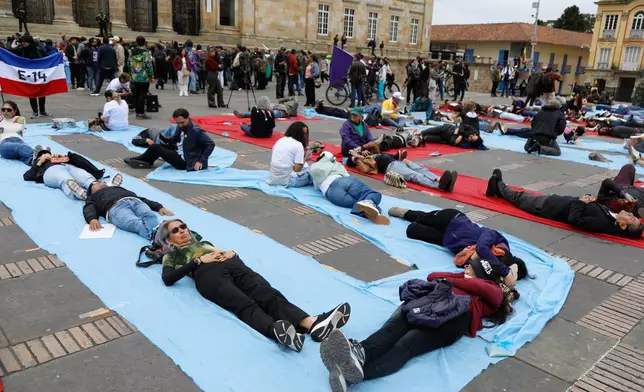Supporters of outgoing President Gustavo Petro protest against President-elect Abelardo de la Espriella on his inauguration day in Bogota, Colombia, Friday, Aug. 7, 2026. (AP Photo/John Vizcaino)