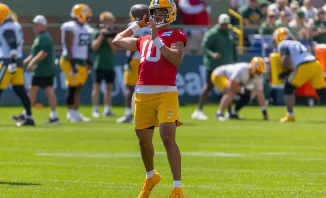 Green Bay Packers quarterback Jordan Love (10) participates in drills during the NFL football team's training camp, Sunday, Aug. 2, 2026, in Green Bay, Wis. (AP Photo/Mike Roemer)