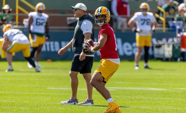 Green Bay Packers quarterback Jordan Love, center right, participates in drills during the NFL football team's training camp, Sunday, Aug. 2, 2026, in Green Bay, Wis. (AP Photo/Mike Roemer)