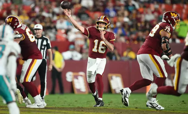 Washington Commanders quarterback Athan Kaliakmanis (16) throws a pass during the second half of an NFL preseason football game against the Miami Dolphins, Friday, Aug. 14, 2026, in Landover, MD. (AP Photo/Nick Wass)
