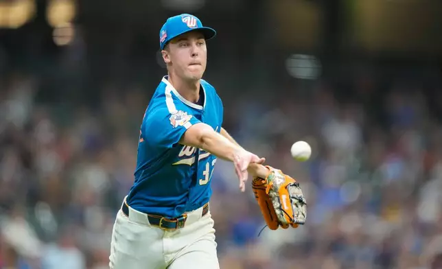 Milwaukee Brewers pitcher Jacob Misiorowski tosses out Atlanta Braves' Drake Baldwin at first base during the third inning of a baseball game Friday, Aug. 21, 2026, in Milwaukee. (AP Photo/Kayla Wolf)