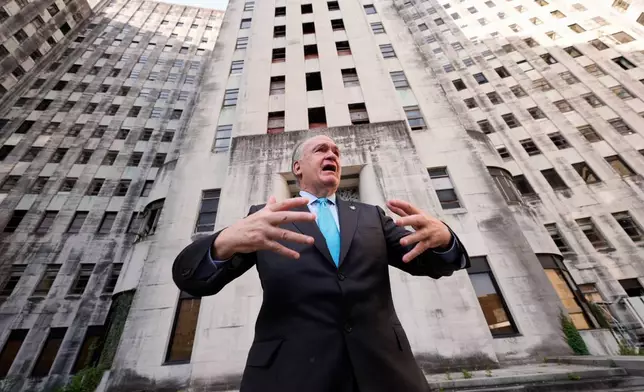 Tulane University president Michael A. Fitts talks outside the old Charity Hospital building Wednesday, Aug. 19, 2026, in New Orleans. (AP Photo/Gerald Herbert)