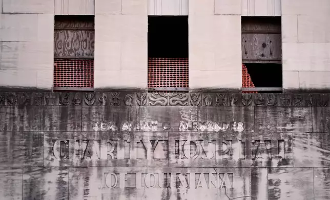 The bas-relief over the entrance of the old Charity Hospital building is seen Wednesday, Aug. 19, 2026, in New Orleans. (AP Photo/Gerald Herbert)