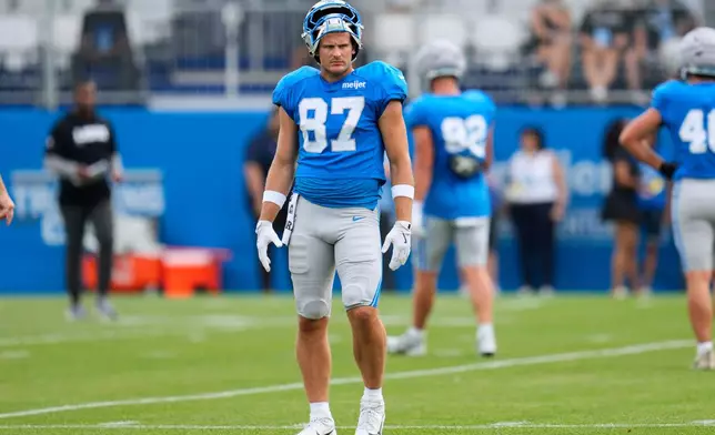 Detroit Lions tight end Sam Laporta watches during practice at the NFL football team's training camp, in Allen Park, Mich., Friday, Aug. 7, 2026. (AP Photo/Paul Sancya)