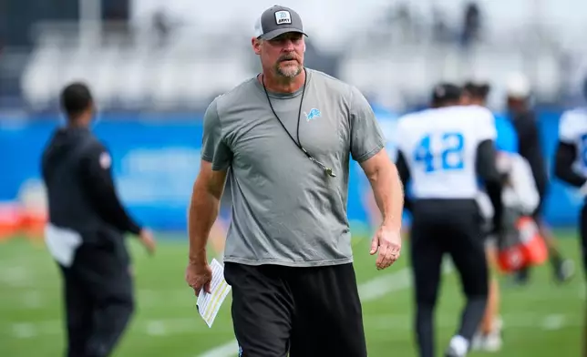 Detroit Lions head coach Dan Campbell watches during practice at the NFL football team's training camp, in Allen Park, Mich., Thursday, Aug. 20, 2026. (AP Photo/Paul Sancya)