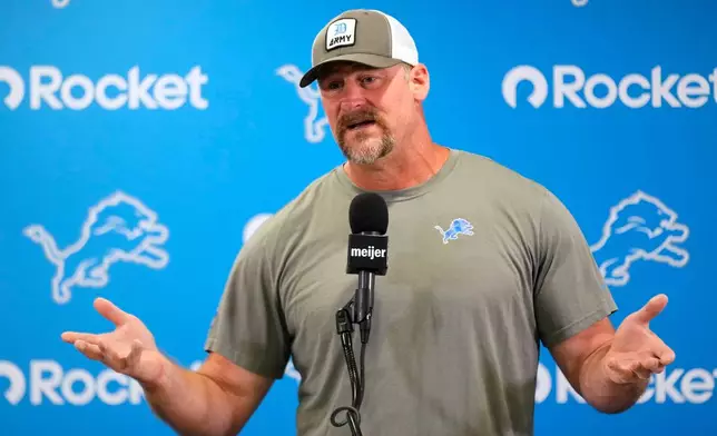 Detroit Lions head coach Dan Campbell talks to the media before practice at the NFL football team's training camp, in Allen Park, Mich., Thursday, Aug. 20, 2026. (AP Photo/Paul Sancya)
