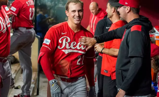 Cincinnati Reds' JJ Bleday, is all smiles after hitting a home run to complete hitting for the cycle during the sixth inning of a baseball game against the Arizona Diamondbacks, Saturday, Aug. 22, 2026, in Phoenix. (AP Photo/Darryl Webb)