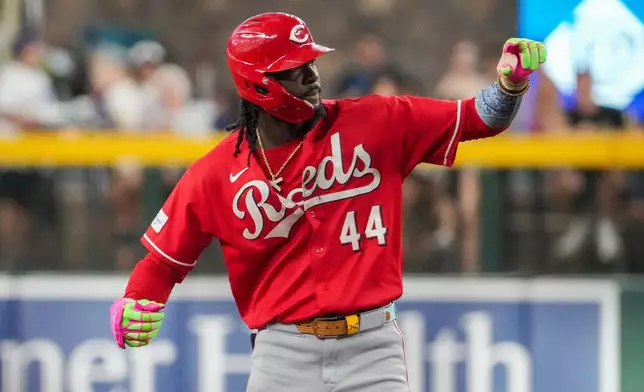 Cincinnati Reds' Elly De La Cruz gestures towards his dugout after hitting a double against the Arizona Diamondbacks during the first inning of a baseball game, Saturday, Aug. 22, 2026, in Phoenix. (AP Photo/Darryl Webb)