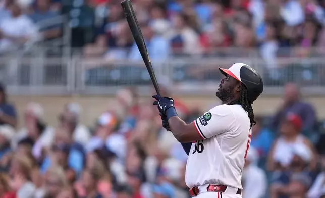 Minnesota Twins' Josh Bell watches his two-run home run during the first inning of a baseball game against the Atlanta Braves Tuesday, Aug. 18, 2026, in Minneapolis. (AP Photo/Abbie Parr)