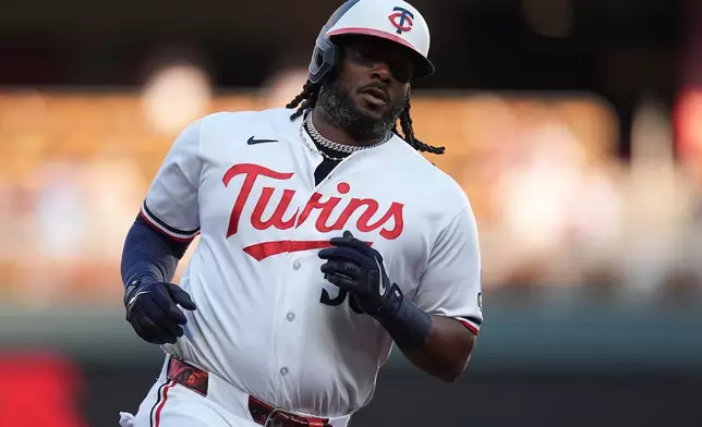 Minnesota Twins' Josh Bell runs the bases after hitting a two-run home run during the first inning of a baseball game against the Atlanta Braves Tuesday, Aug. 18, 2026, in Minneapolis. (AP Photo/Abbie Parr)