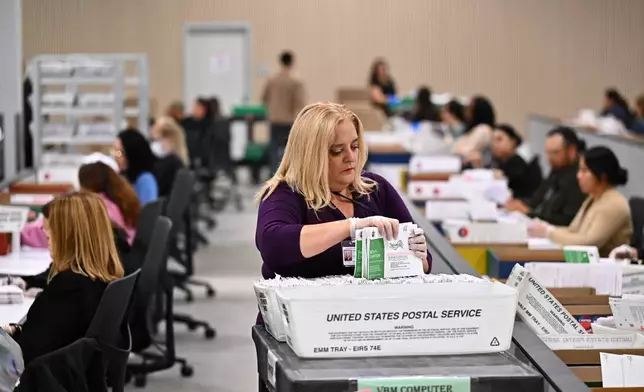 FILE - A worker sorts ballots at the L.A. County Ballot Processing Center during the California primary election, June 2, 2026, in City of Industry, Calif. (AP Photo/William Liang, File)